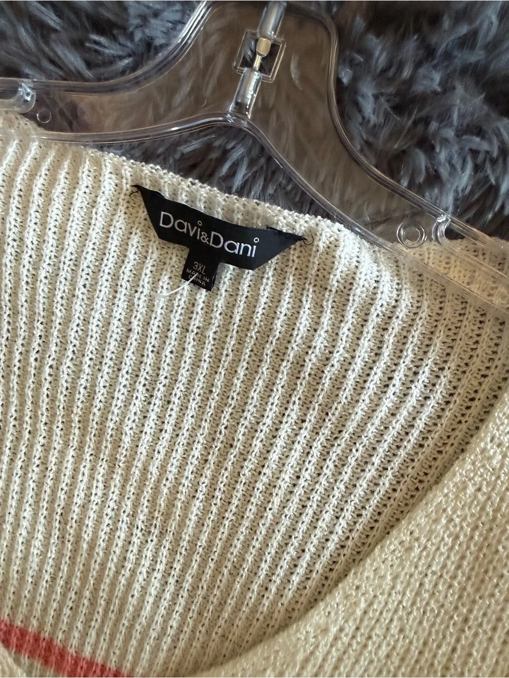 Cream V-Neck Sweater with Pastel Rainbow Stripes